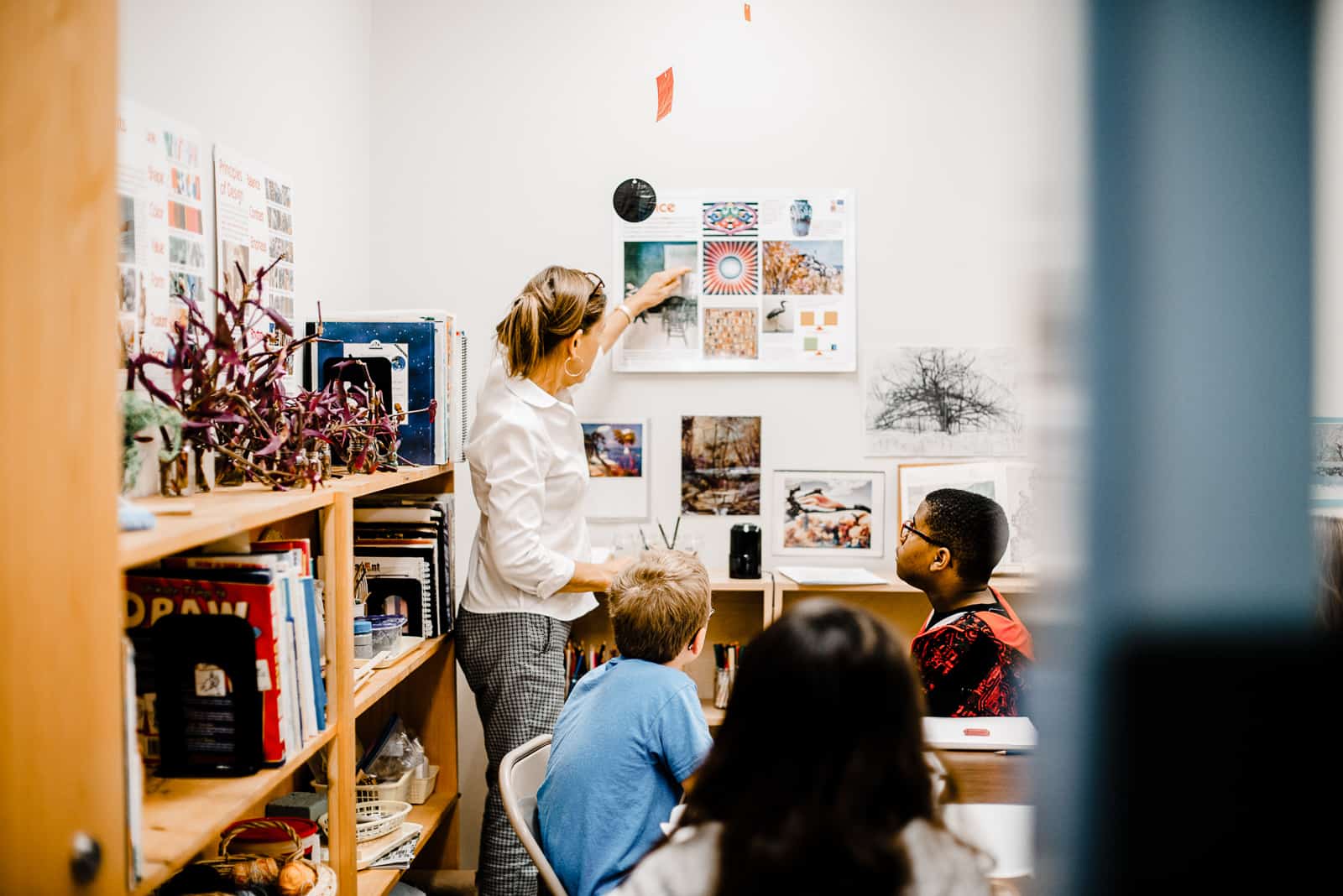 Ms. Donna, art teacher, gives a lesson to Montessori middle school students