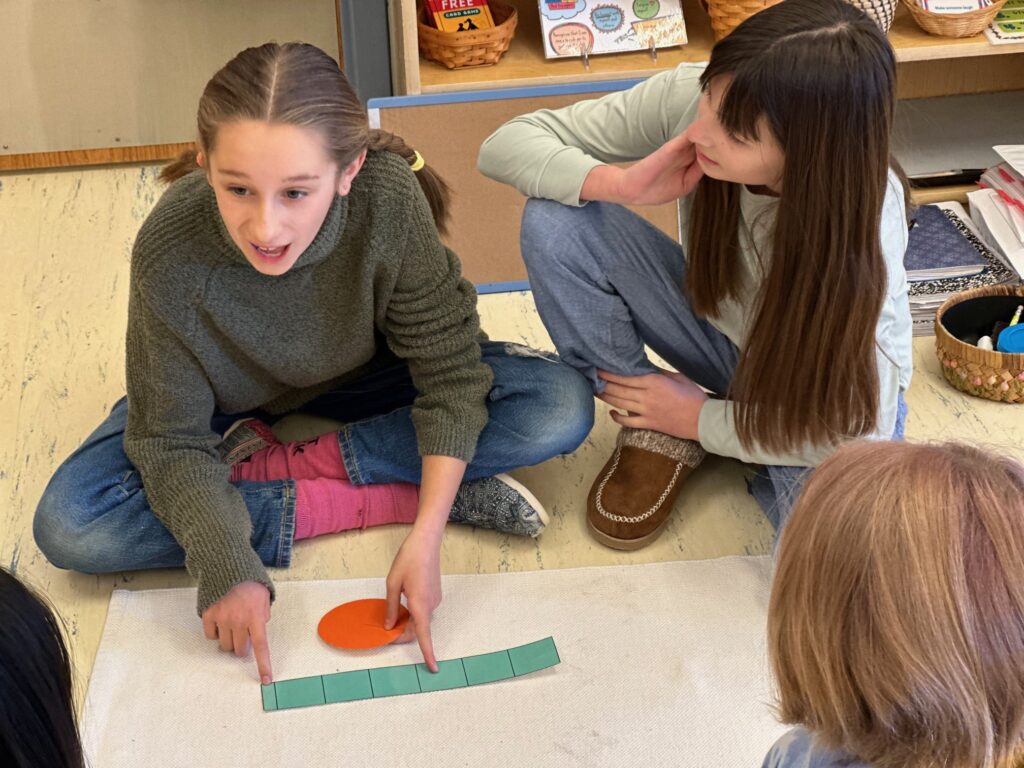 Montessori students give a lesson on derivation of circumference at Chesapeake Montessori School